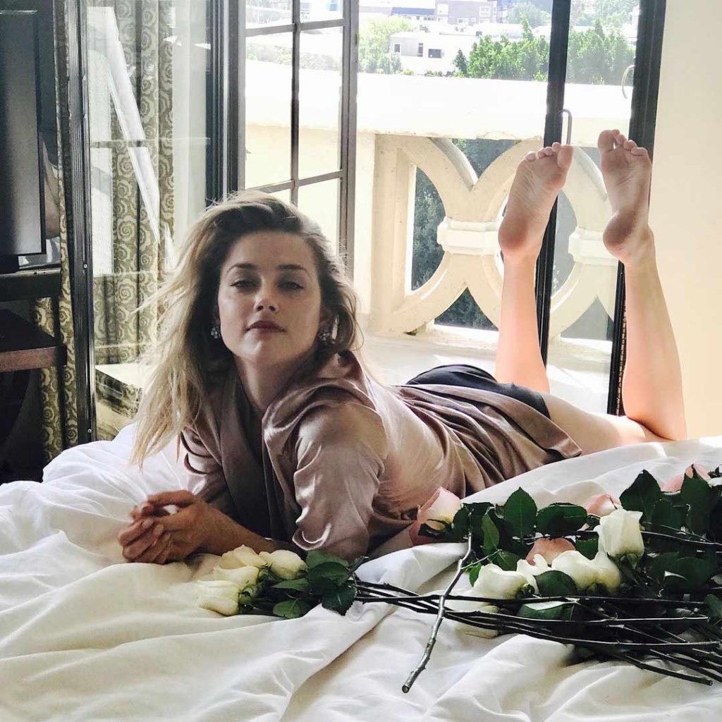 Amber Heard on bed Hot Photo