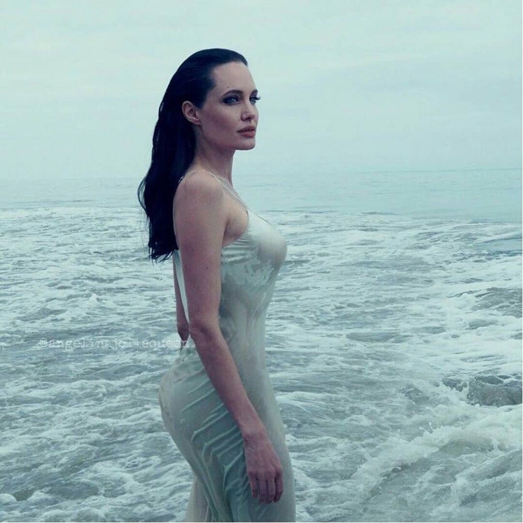 Angelina Jolie in wet dress on a beach HD Hot Image