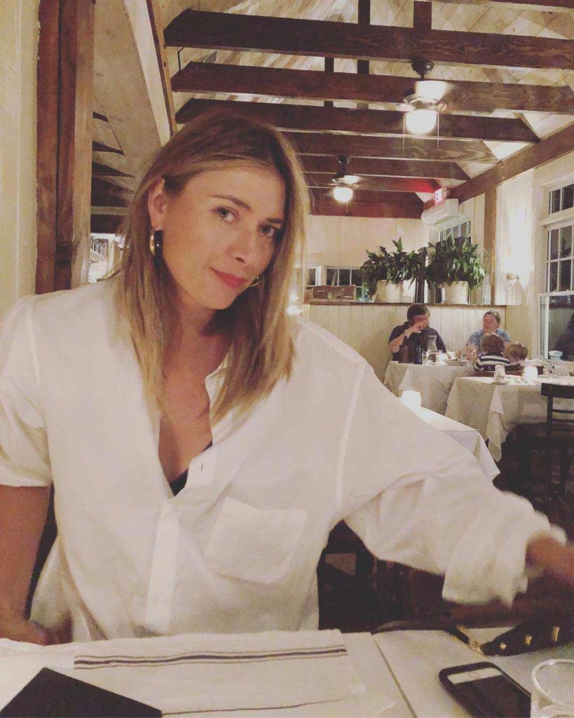Maria Sharapova in white formal shirt in a restaurant HD