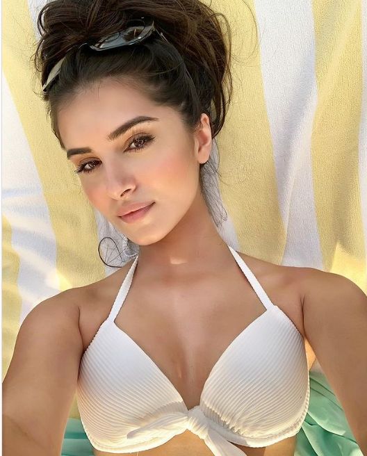 Tara Sutaria Scintillating and Hot Pic in White Halterneck Bralette