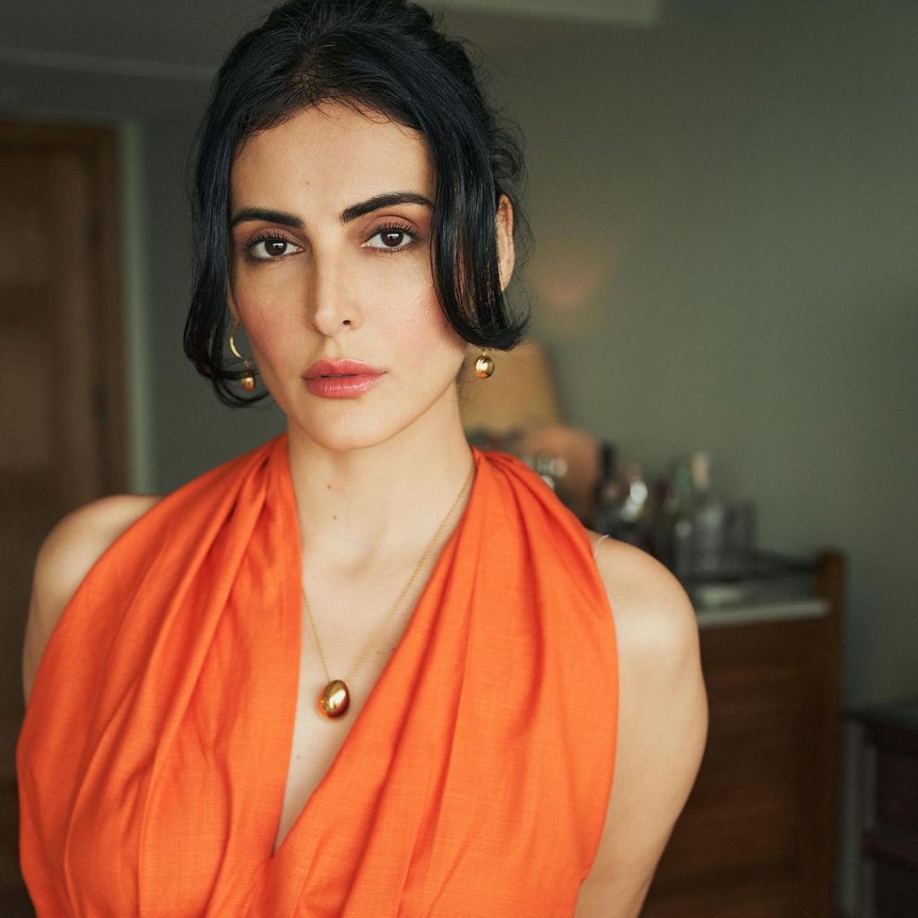 Beautiful Mandana Karimi in orange outfit HD Picture Biographia Biographia
