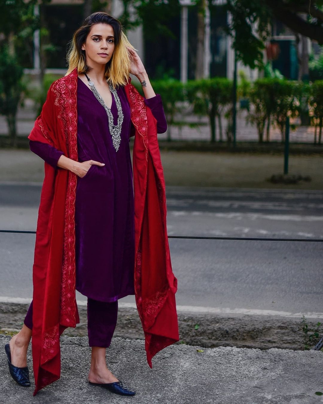 Akanksha Redhu one of the Top Female Fashion Influencers of India in a Wine Velvet Angrakha Set Paired with a Beautiful Embroidered Red Velvet Shawl Biographia