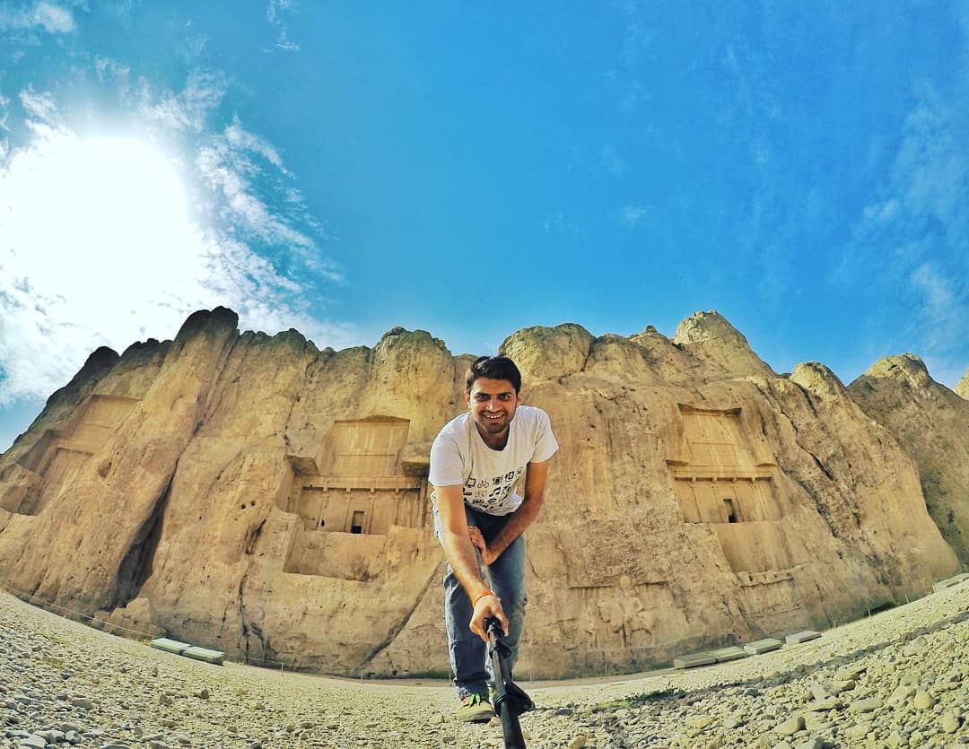 Deepanshu Sangwan Creator of YouTube Travel Vlogging Channel Nomadic Indian taking Selfie in Naqsh E Rostam Fars Iran