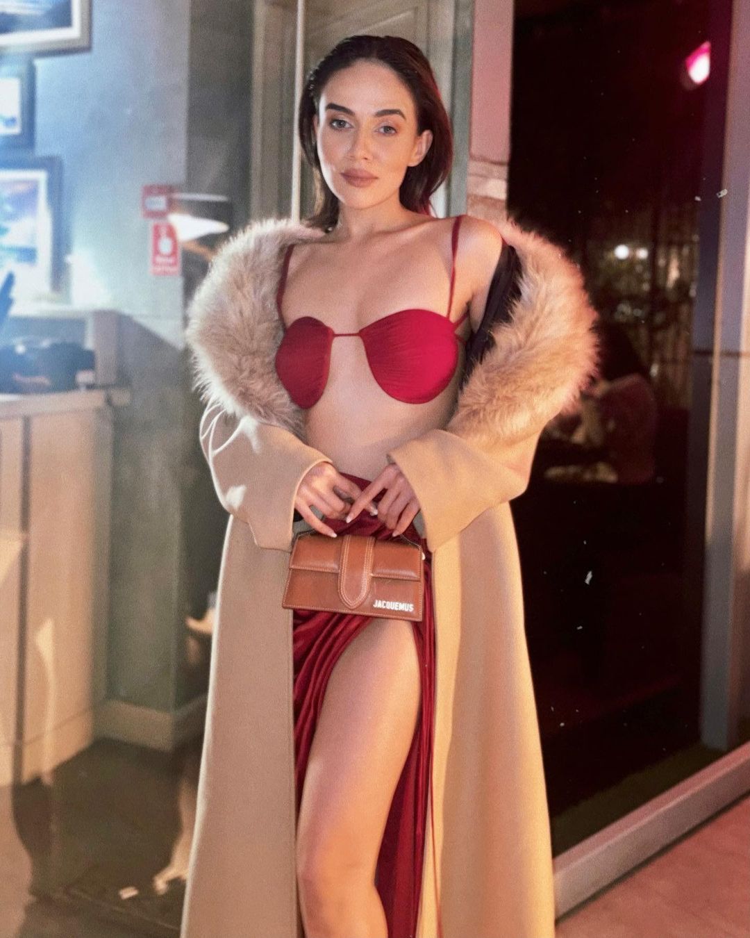 Fashion Influencer Komal Pandey Blazing Hot Pic in a Red Bralette and Brown Fur Overcoat
