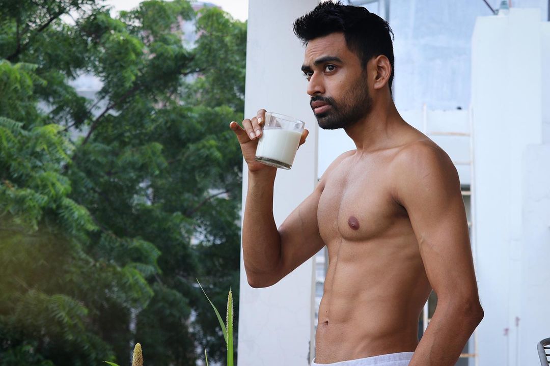 Health Influencer Vivek Mittal showing his Ripped Body with a Glass of Milk
