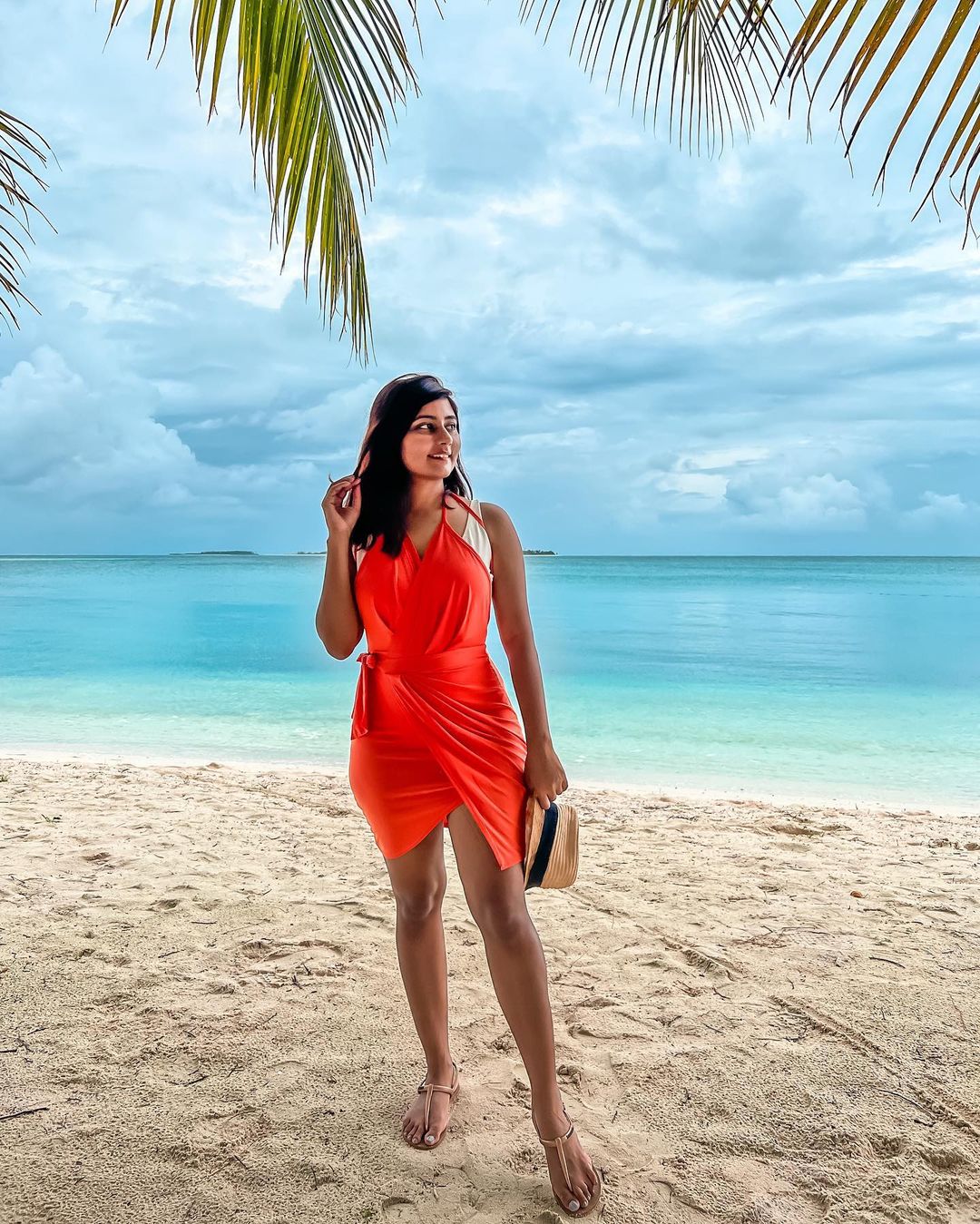 Kritika Goel Enjoying in Lakshadweep in one of her Travel Vlogs in Orange Bodycon Dress