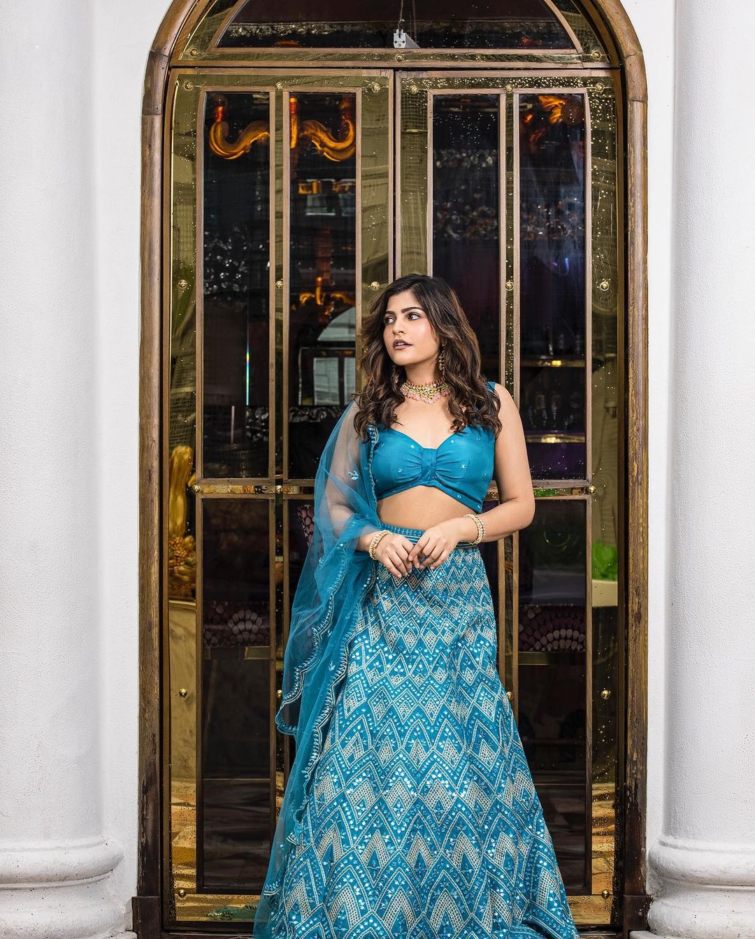 Kritika Khurana a Popular Female Fashion Influencer posing for Fab Look Magazine in Blue Bralette and Lehenga