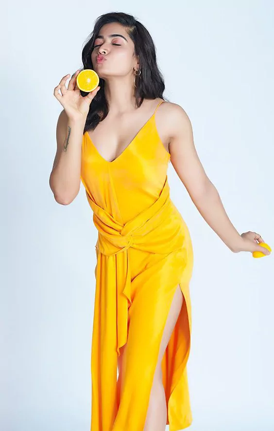Rashmika Mandanna wearing a sexy orange slit maxi dress looks hot