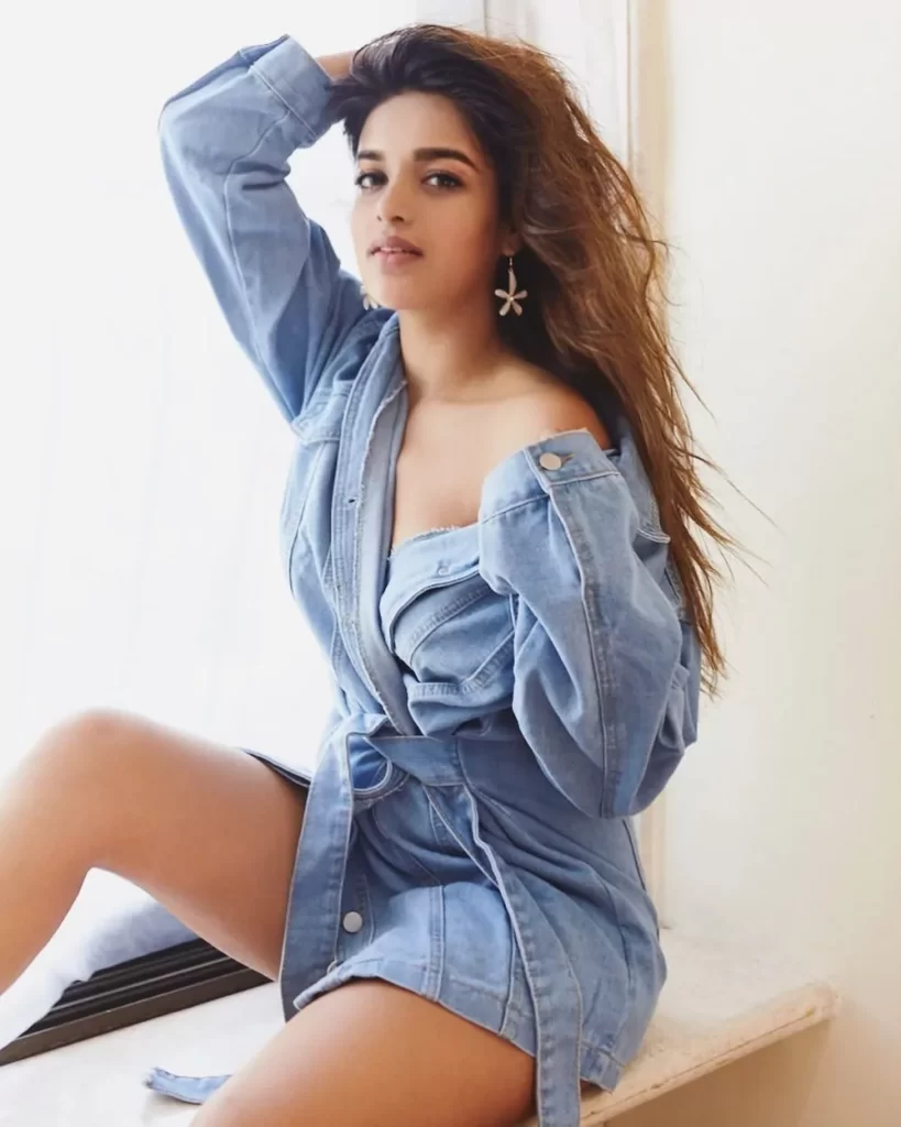 Nidhhi Agerwal flaunts her creme complexition looks and svelte figure
