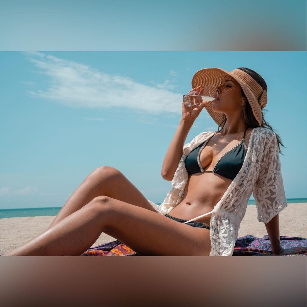 Sizzling hot Almendra Castillo in green bikini teamed up with a round hat and floral shrug HD Picture Biographia